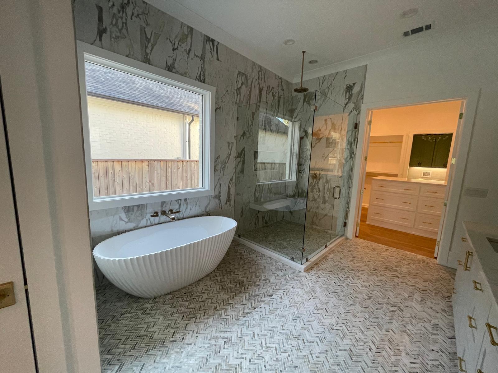 Open living and kitchen — finished interior with marble fireplace